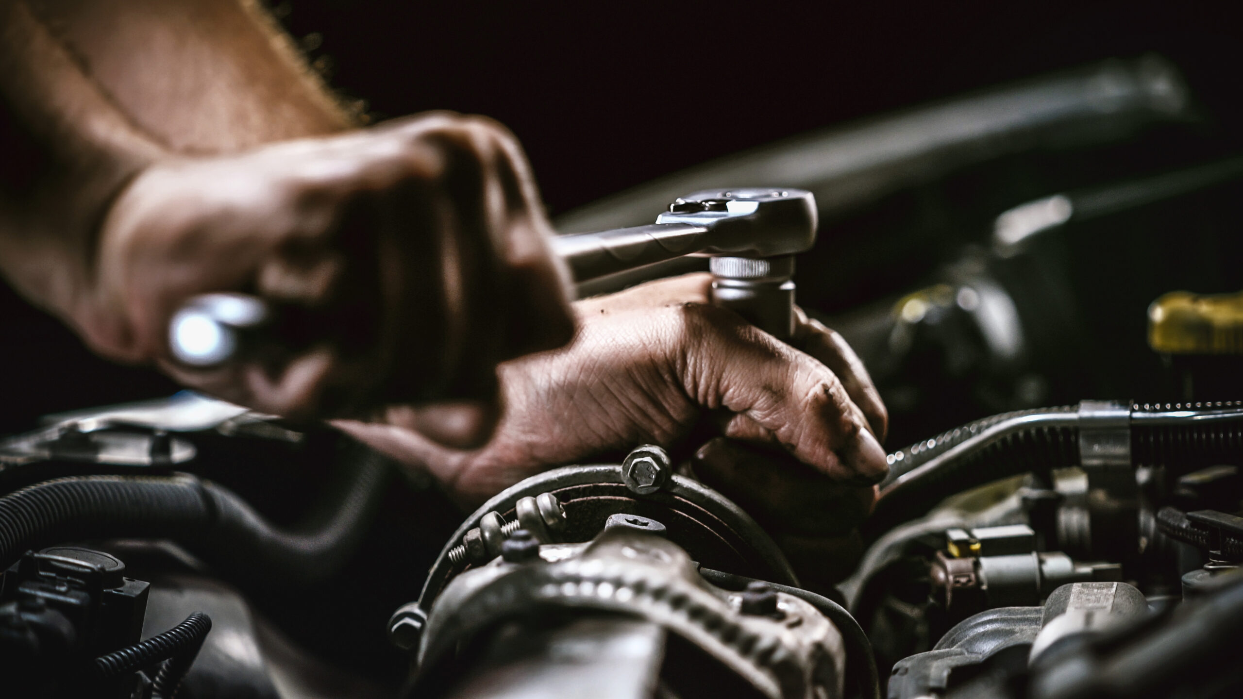 Mechanic Working on Engine