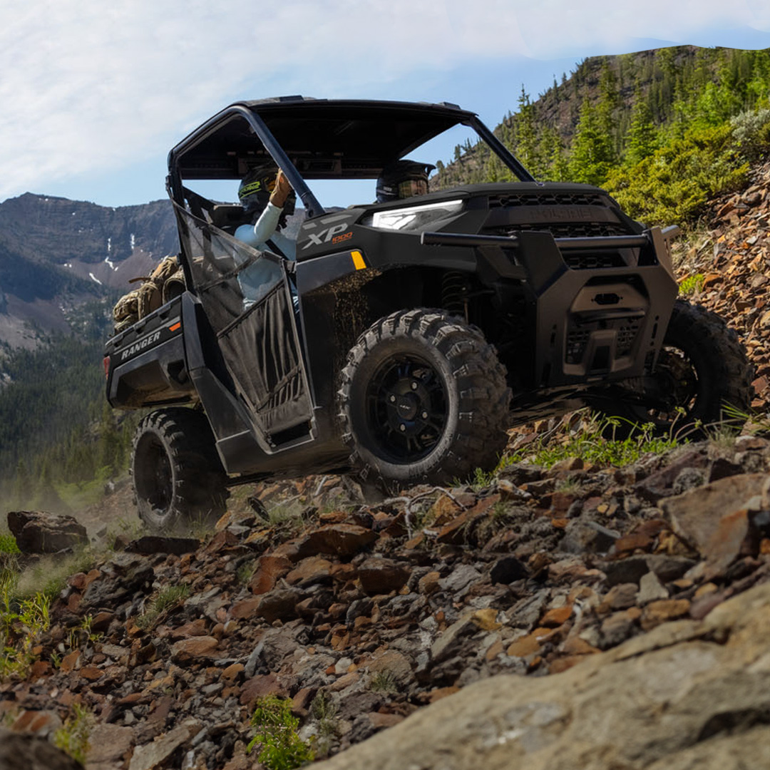 Polaris Ranger XP 1000 driving on a rocky terrain